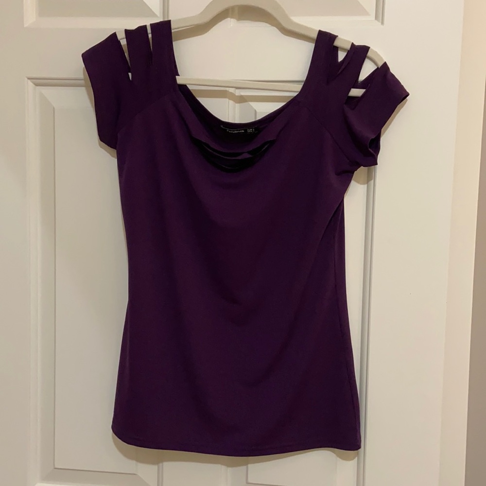 Purple cap sleeve shirt with rip cuts.